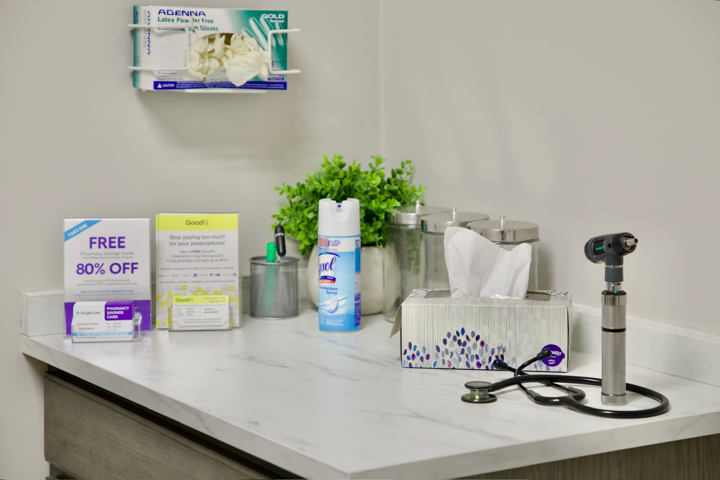 Exam room counter with a stethoscope, otoscope and supplies
