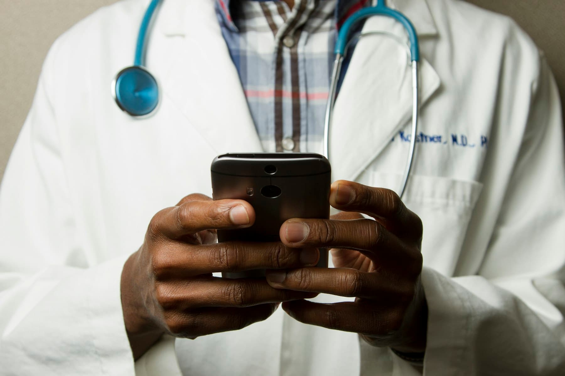 Medical provider preparing patient care on a phone